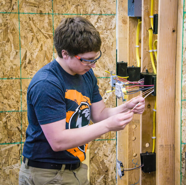 UBTech Electrical Technician student competing at recent UBTech Showcase, demonstrating hands-on skills in electrical wiring. 