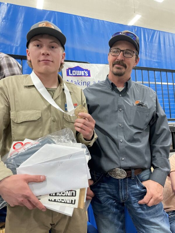 Proud UBTech Welding Instructor (right) Kevin Mitchel, pictured with UBTech graduate, Wyatt Hansen (left) sporting the National SkillsUSA Gold Medal in welding.