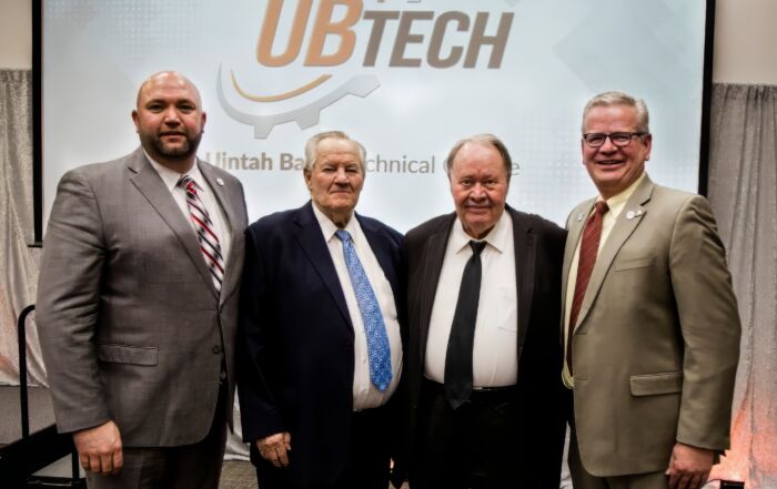 Past presidents celebrate Dick Jones as a recipient of the 2020 UBTech Champion Award. From left to right, Current UBTech President, Aaron K. Weight; Garth Sorensen, Dick Jones, and Paul Hacking.