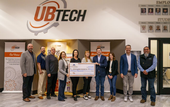 UBTech leaders and FourPoint Resources representatives celebrate a new partnership with a ceremonial check presentation. FourPoint’s $15,000 donation will fund scholarships for UBTech students, including dedicated support for members of the Ute Indian Tribe and their direct descendants.