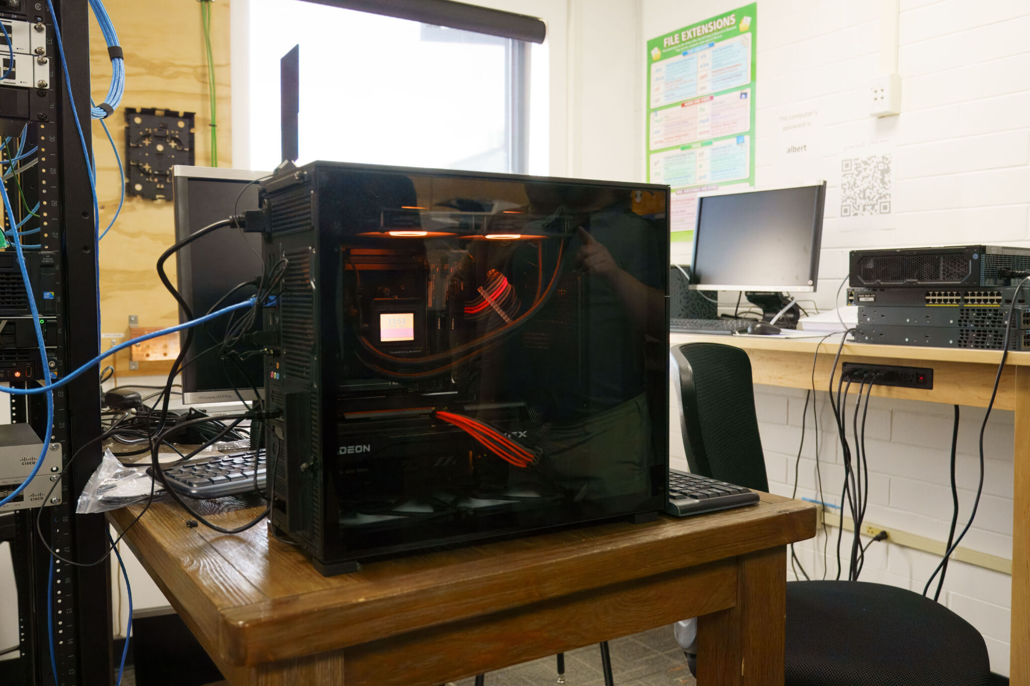 Custom Built PC A black PC tower with glass showing all the parts on the inside