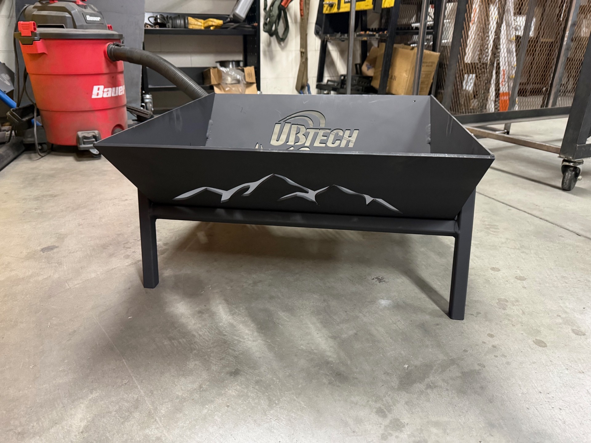 Fire Pit Firepit with UBTech and mountain decoration in a storage room.