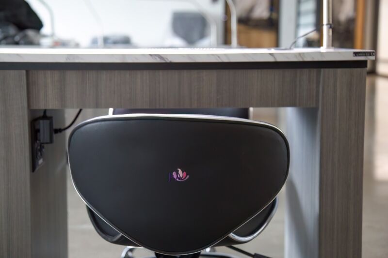 The focus is on a chair at a nail station.