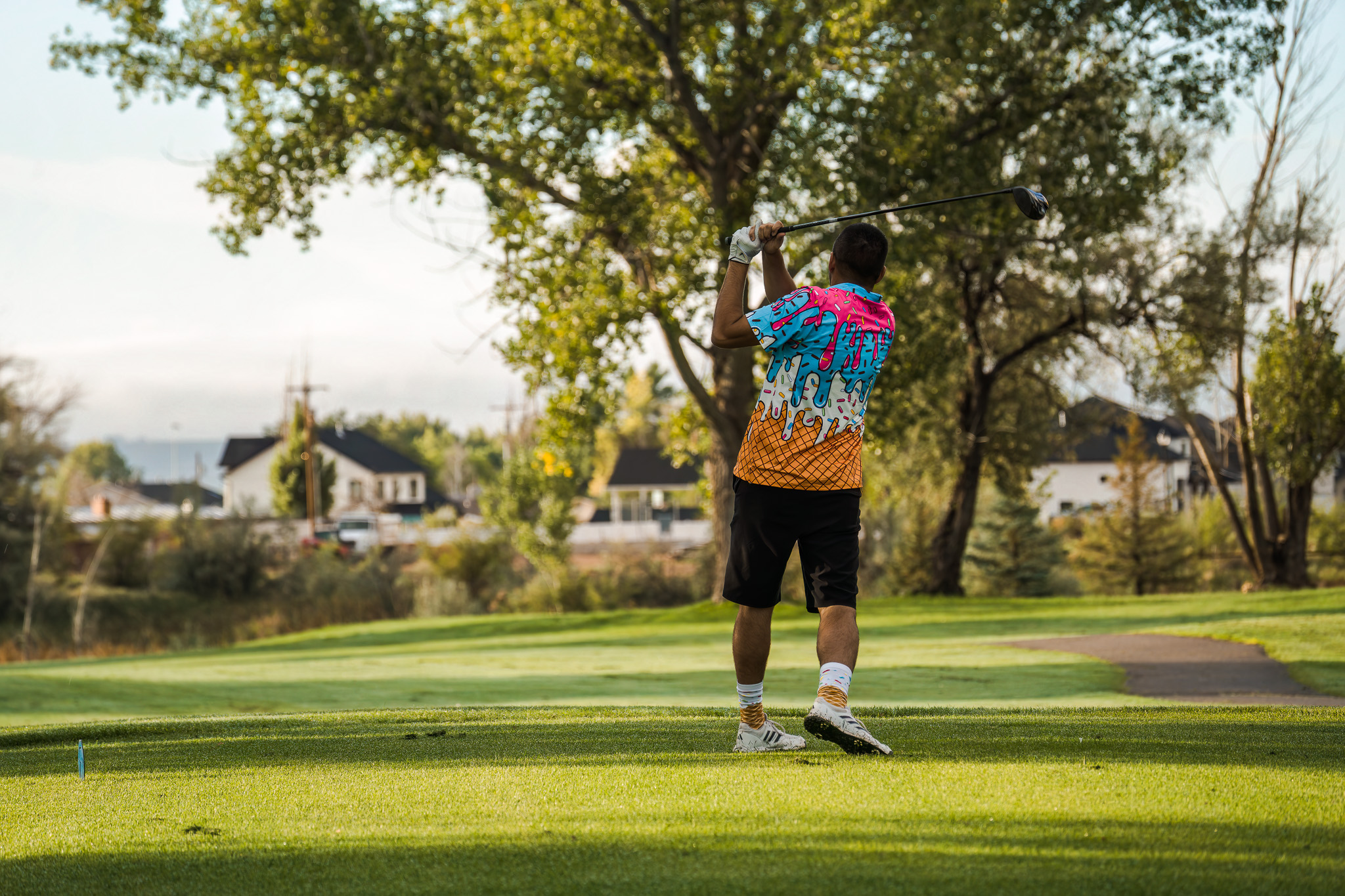 A male golfer swinging